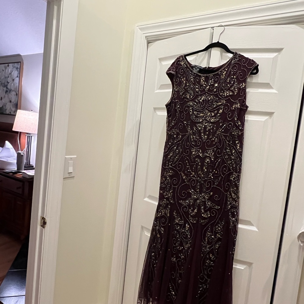 Cocktail gown in maroon color hand embroidered . Polyester rayon . Size 16W